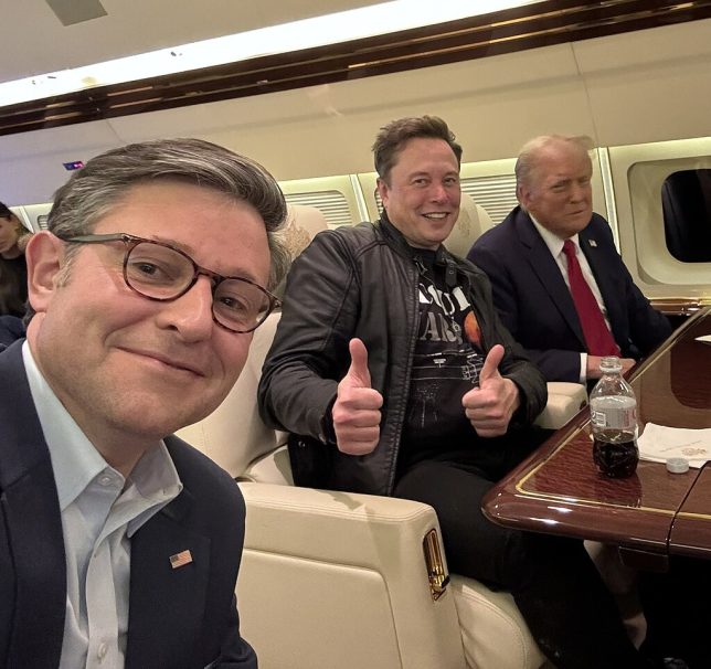 Mike Johnson taking a selfie with Elon Musk and Donald Trump.